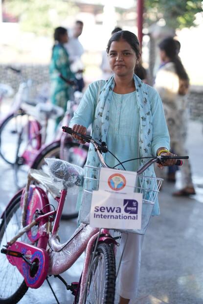 SHE RIDE bicycle distribution girl